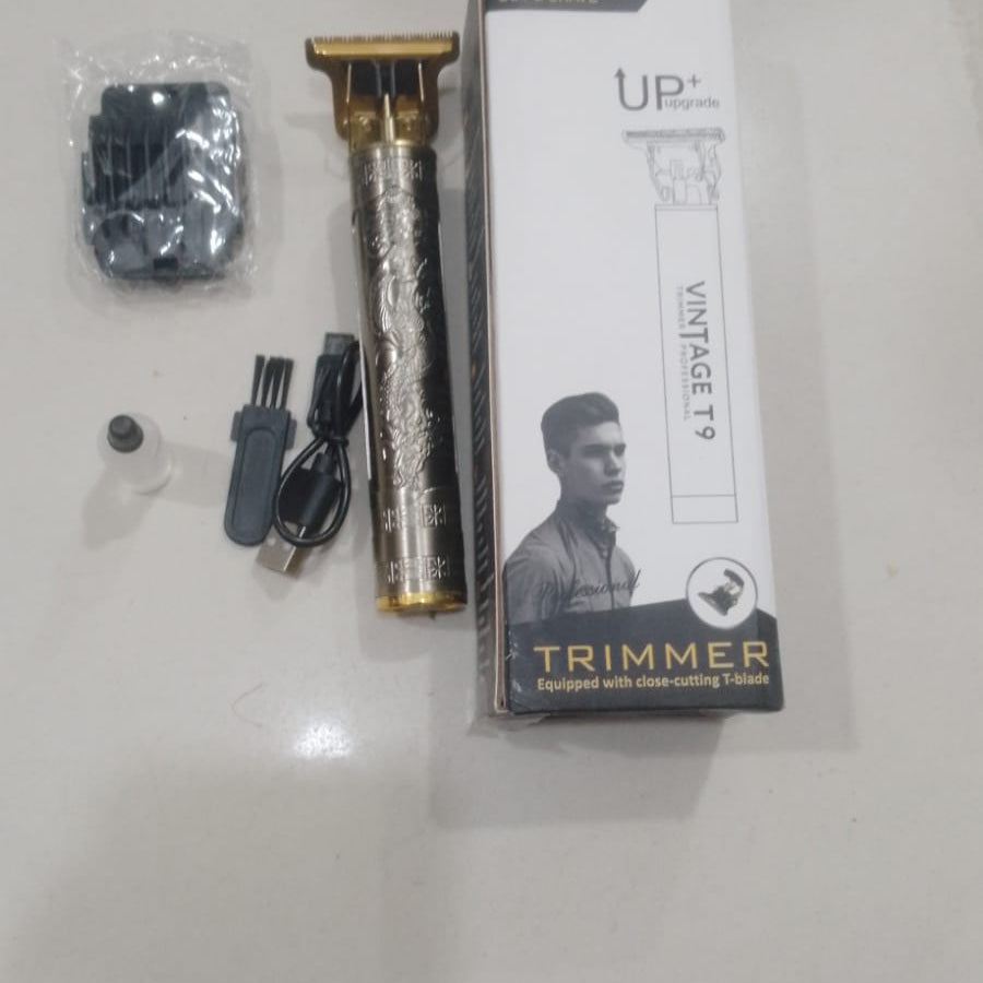 Hair trimmer set with packaging on a light gray surface