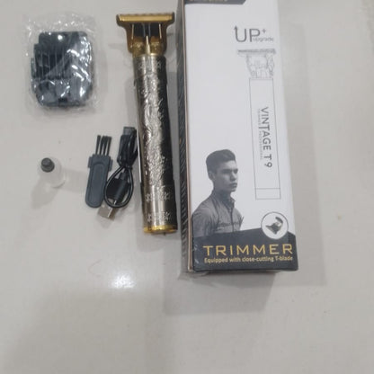 Hair trimmer set with packaging on a light gray surface
